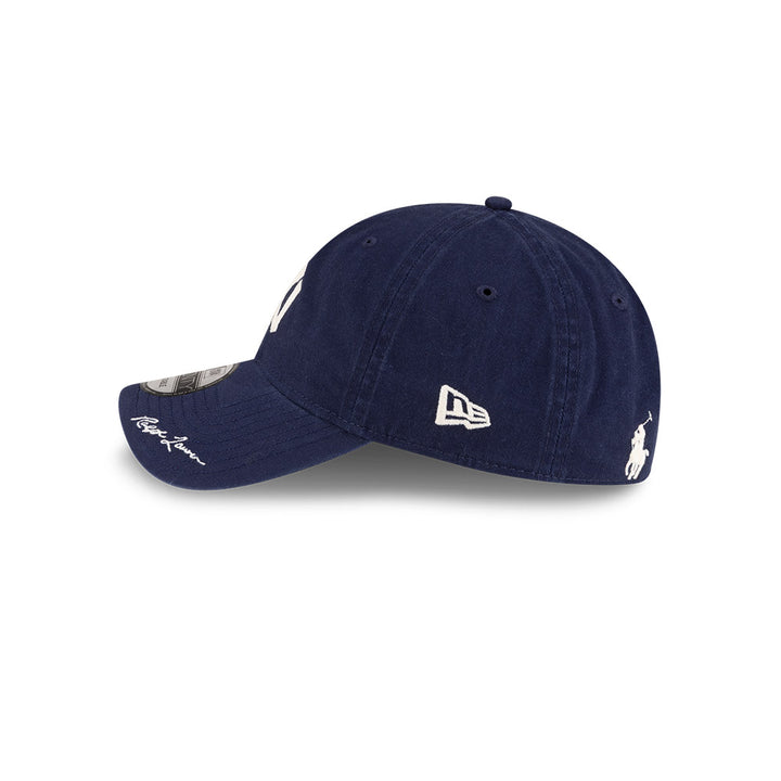 Left side profile view of New Era x Ralph Lauren Yankees 9TWENTY Navy Cap featuring the classic New Era flag logo.