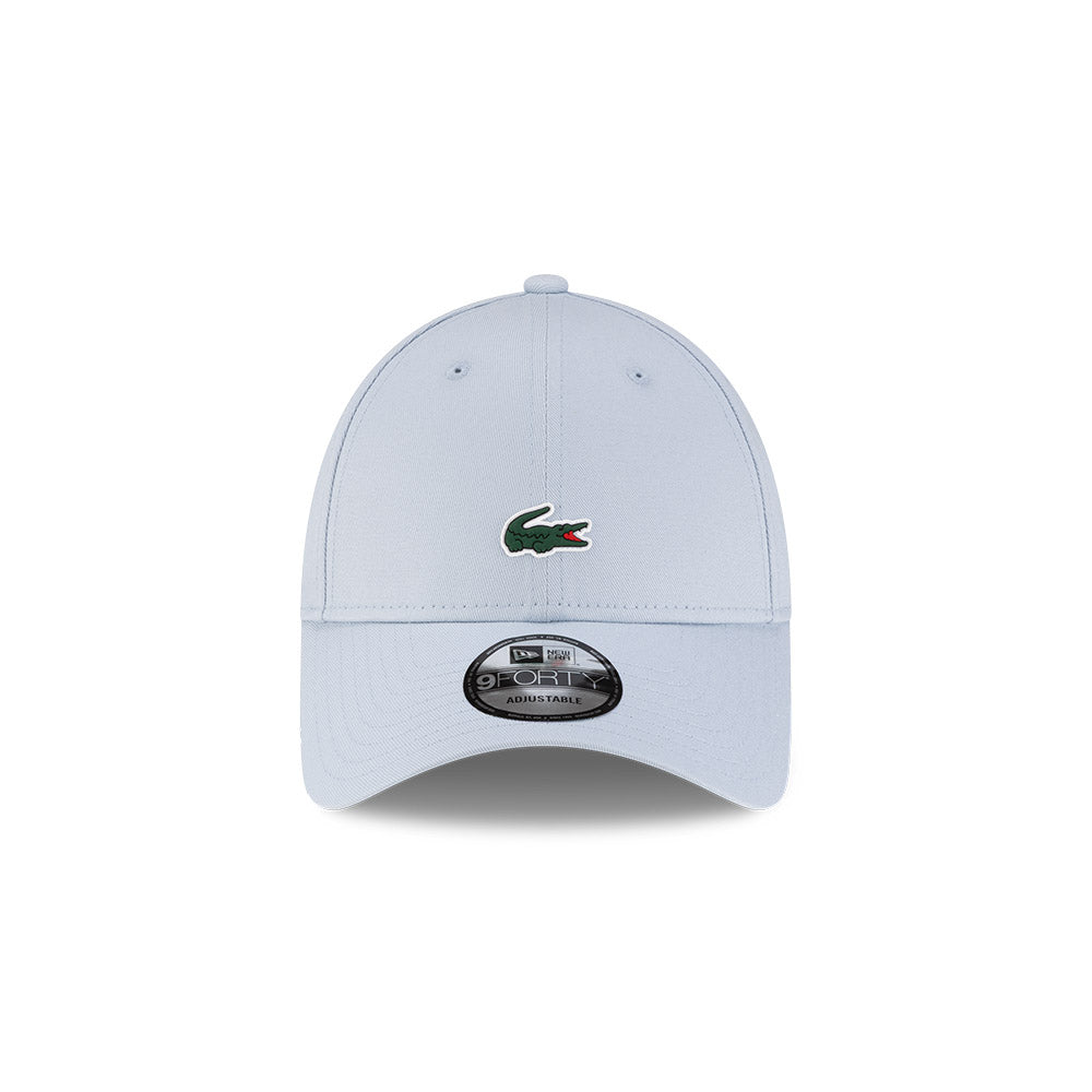 Front view of New Era x Lacoste 9FORTY Core Light Blue Adjustable Cap highlighting the centered crocodile logo