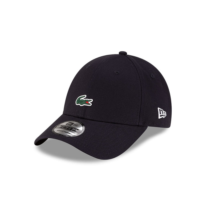 Front left view of New Era x Lacoste 9FORTY Core Navy Adjustable Cap highlighting the classic New Era flag logo