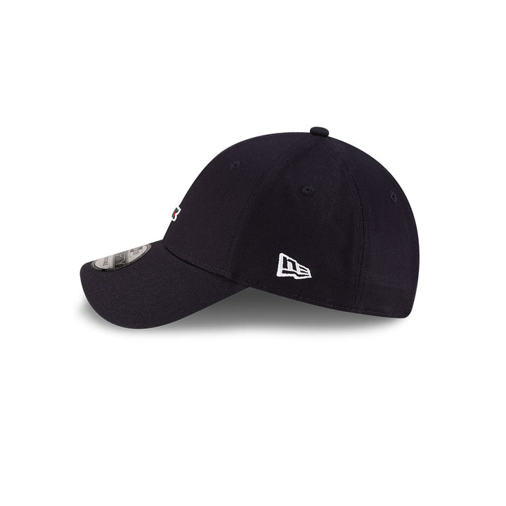 Left side profile view of New Era x Lacoste 9FORTY Core Navy Adjustable Cap featuring stitched white flag logo.