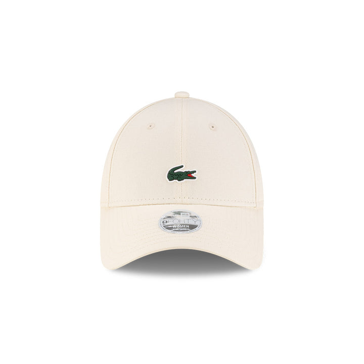 Front view of New Era x Lacoste 9FORTY Women Core Light Beige Adjustable Cap highlighting the centered crocodile logo