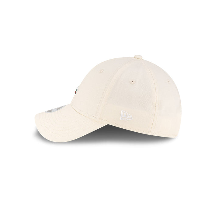 Left side profile view of New Era x Lacoste 9FORTY Women Core Light Beige Adjustable Cap featuring stitched white flag logo.