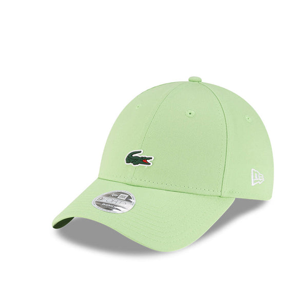 Front left view of New Era x Lacoste 9FORTY Women Core Pastel Green Adjustable Cap highlighting the classic New Era flag logo