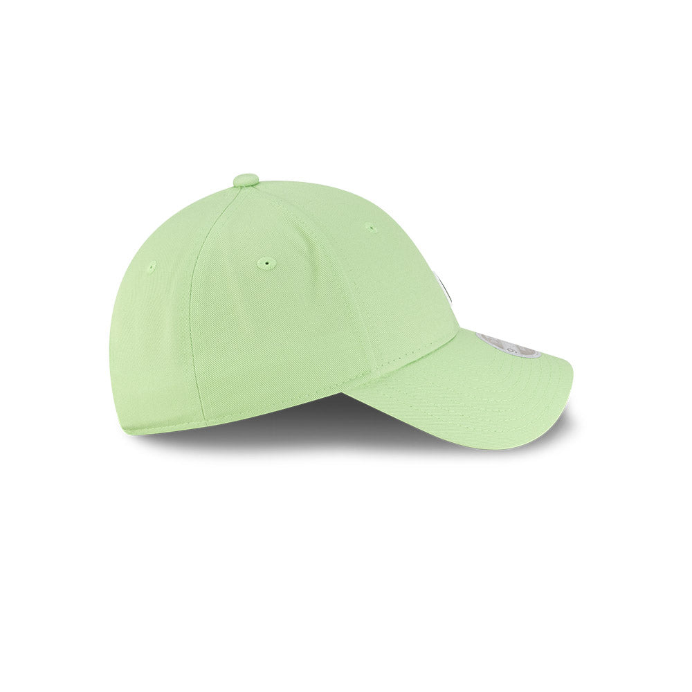 Right side profile view of New Era x Lacoste 9FORTY Women Core Pastel Green Adjustable Cap showing pre-curved visor.