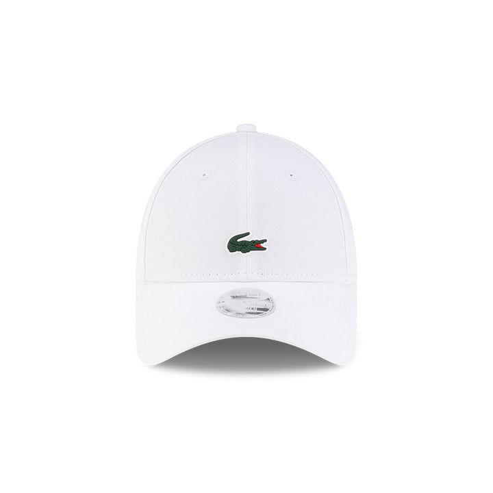 Front view of New Era x Lacoste 9FORTY Women Core White Adjustable Cap highlighting the centered crocodile logo