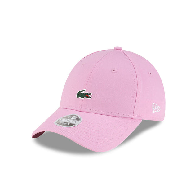 Front left view of New Era x Lacoste 9FORTY Women Core Pastel Pink Adjustable Cap highlighting the classic New Era flag logo