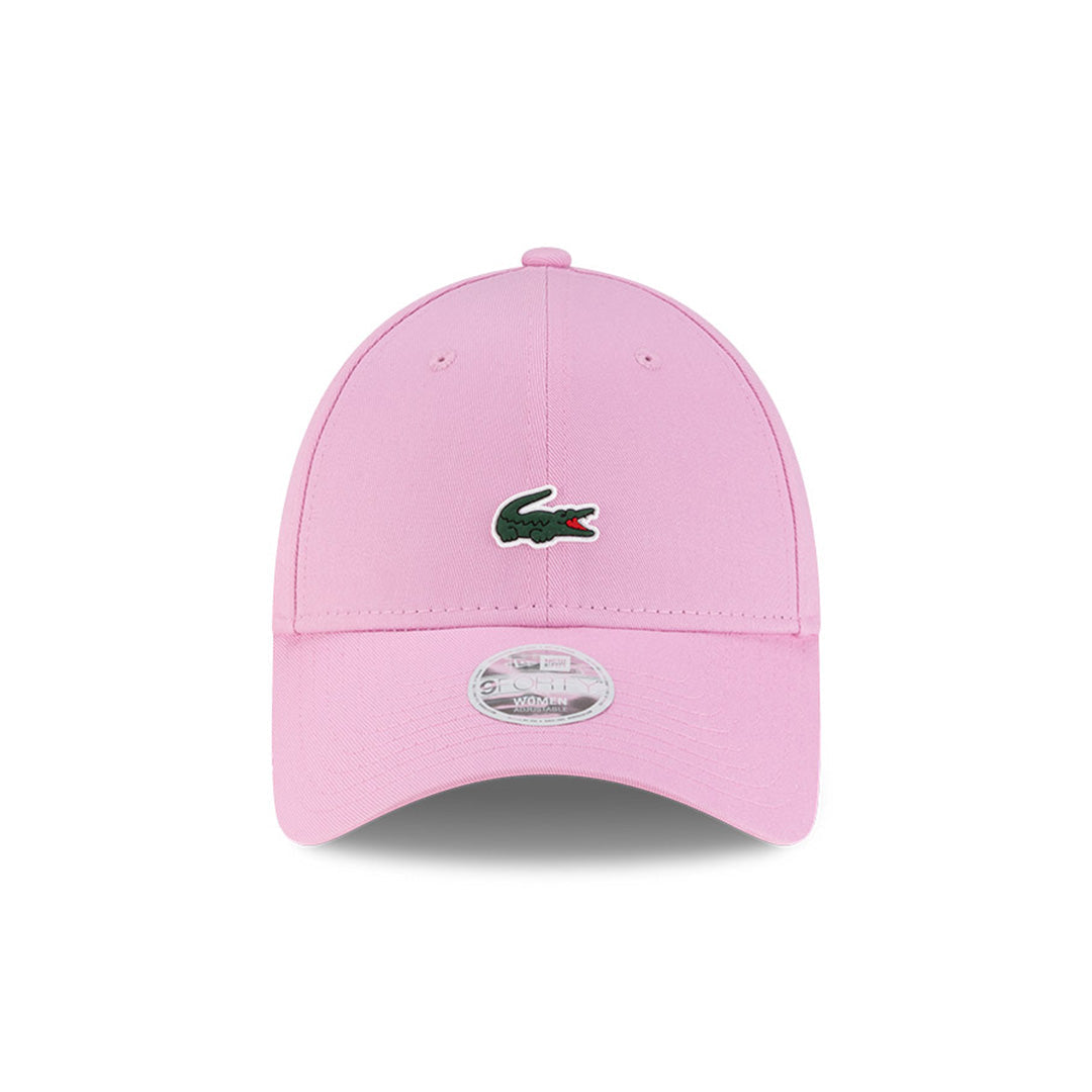 Front view of New Era x Lacoste 9FORTY Women Core Pastel Pink Adjustable Cap highlighting the centered crocodile logo