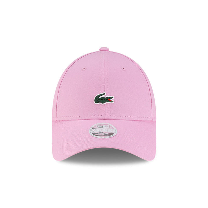 Front view of New Era x Lacoste 9FORTY Women Core Pastel Pink Adjustable Cap highlighting the centered crocodile logo