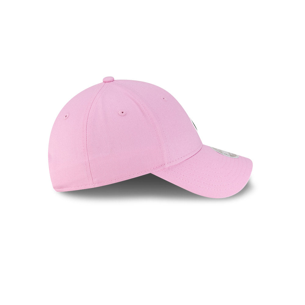 Left side profile view of New Era x Lacoste 9FORTY Women Core Pastel Pink Adjustable Cap featuring stitched white flag logo.