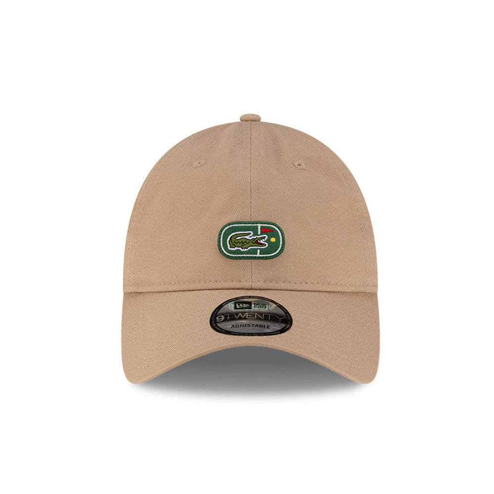 Front view of New Era x Lacoste 9TWENTY Flag Beige Adjustable Cap highlighting the centered iconic crocodile logo.