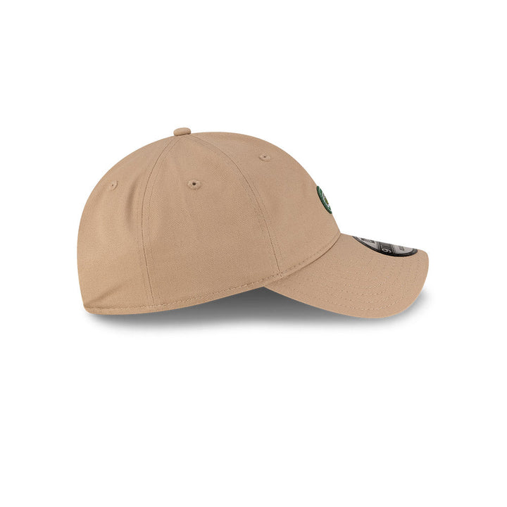 Right side profile view of New Era x Lacoste 9TWENTY Flag Beige Adjustable Cap showing pre-curved visor.