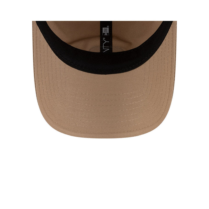 Undervisor view of New Era x Lacoste 9TWENTY Flag Beige Adjustable Cap showing the clean under-brim detail.