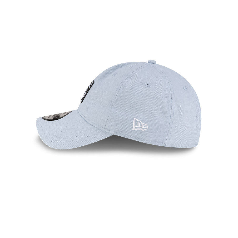 eft side profile view of New Era x Lacoste 9TWENTY Golf Ball Pastel Blue Adjustable Cap featuring stitched New Era flag logo.