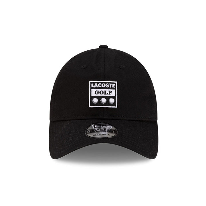 Front view of New Era x Lacoste 9TWENTY Golf Ball Black Adjustable Cap highlighting the rectangular Lacoste Golf patch